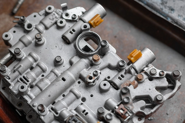 Transmission valve body module sitting on workbench